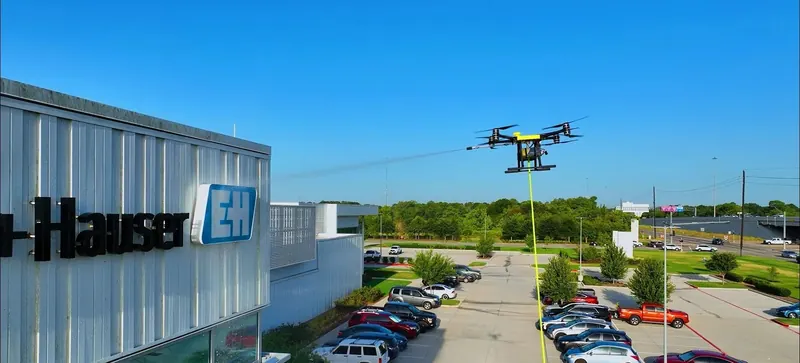 Drone Cleaning Service washing the exterior of a commercial building