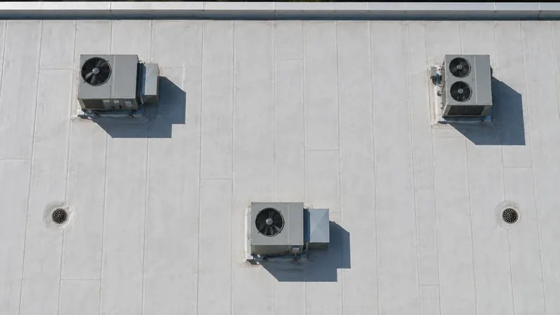 A clean white commercial roof seen from above